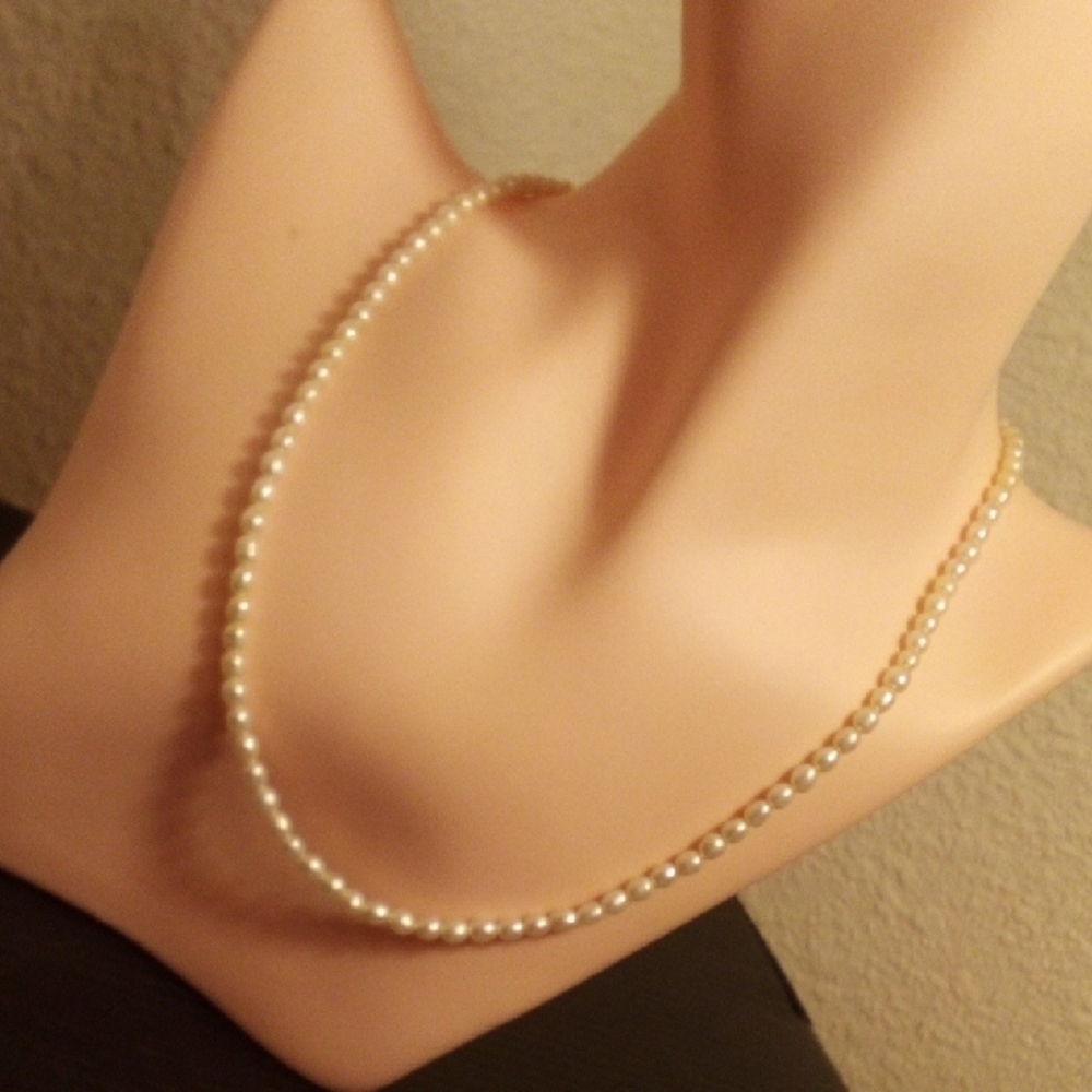 Elegant White Pearlâ Strand Necklace for Women